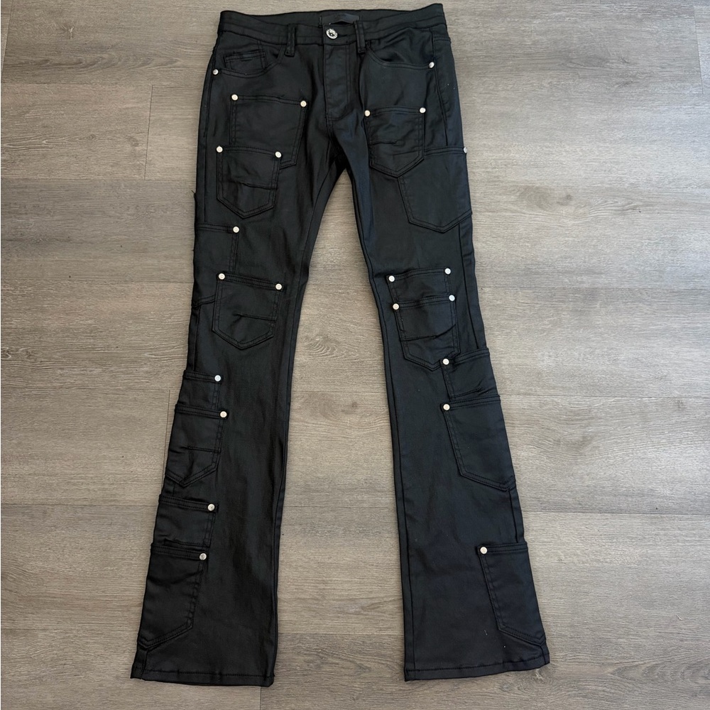 Stacked black leather bell bottom jeans
